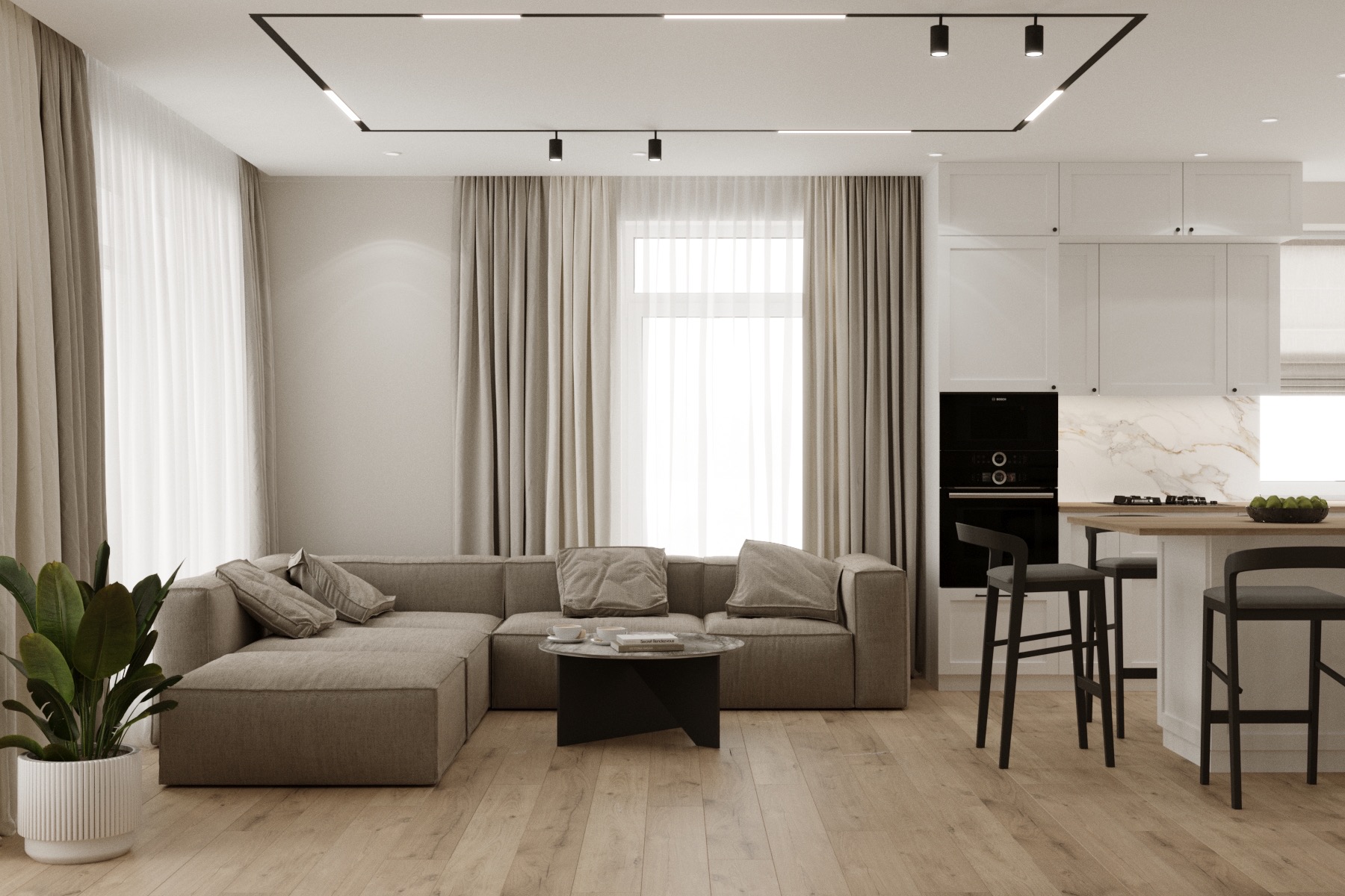 Jasne, nowoczesne wnętrze mieszkania z narożną sofą w odcieniach beżu, okrągłym stolikiem kawowym, białymi zasłonami i kuchnią z wyspą oraz hokerami w tle, oświetlone lampami sufitowymi.