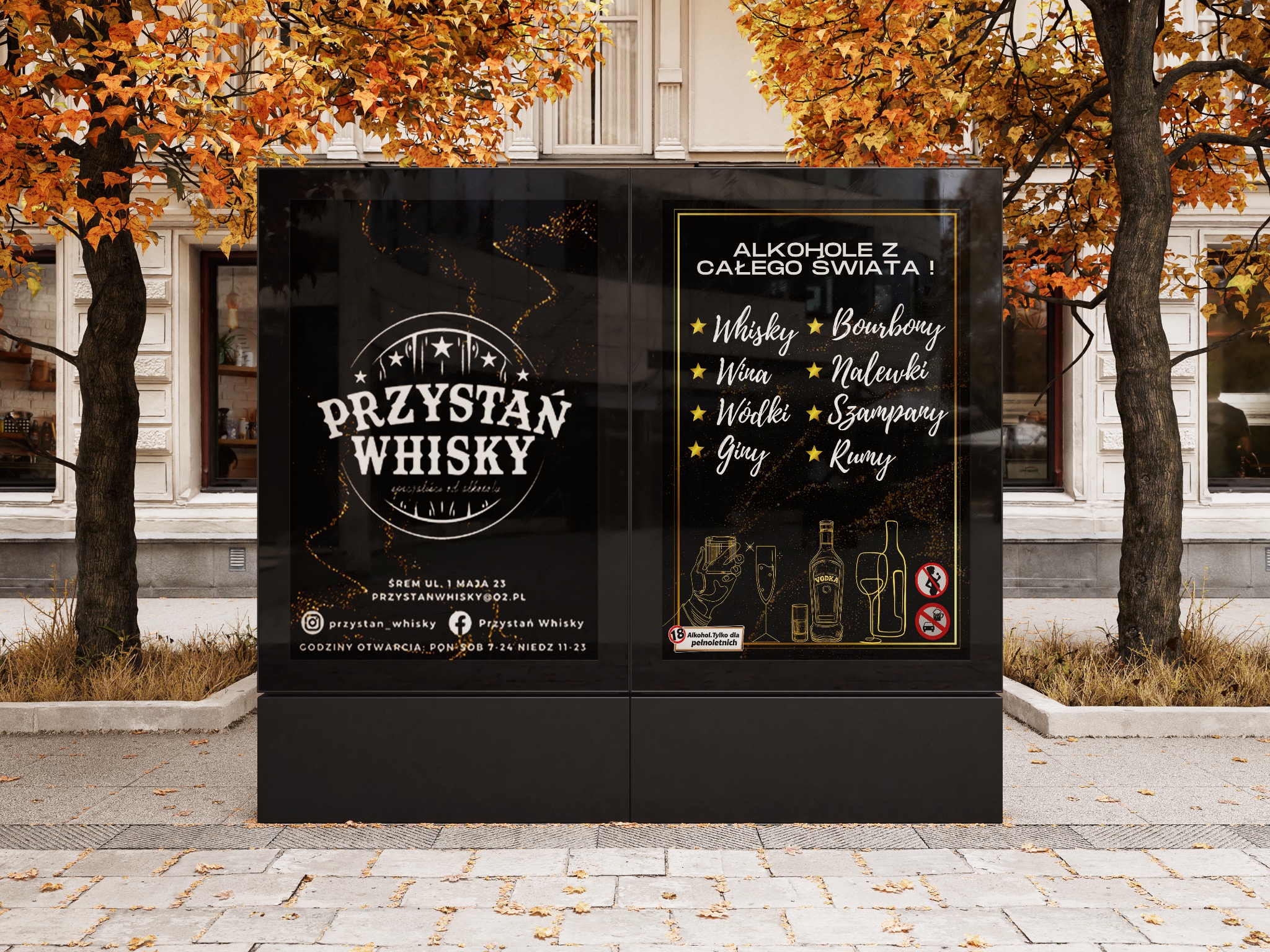 Billboard reklamowy z czarnym tłem prezentujący ofertę baru 'Przystań Whisky' z alkoholem z całego świata, umieszczony na chodniku w otoczeniu drzew w jesiennej scenerii.