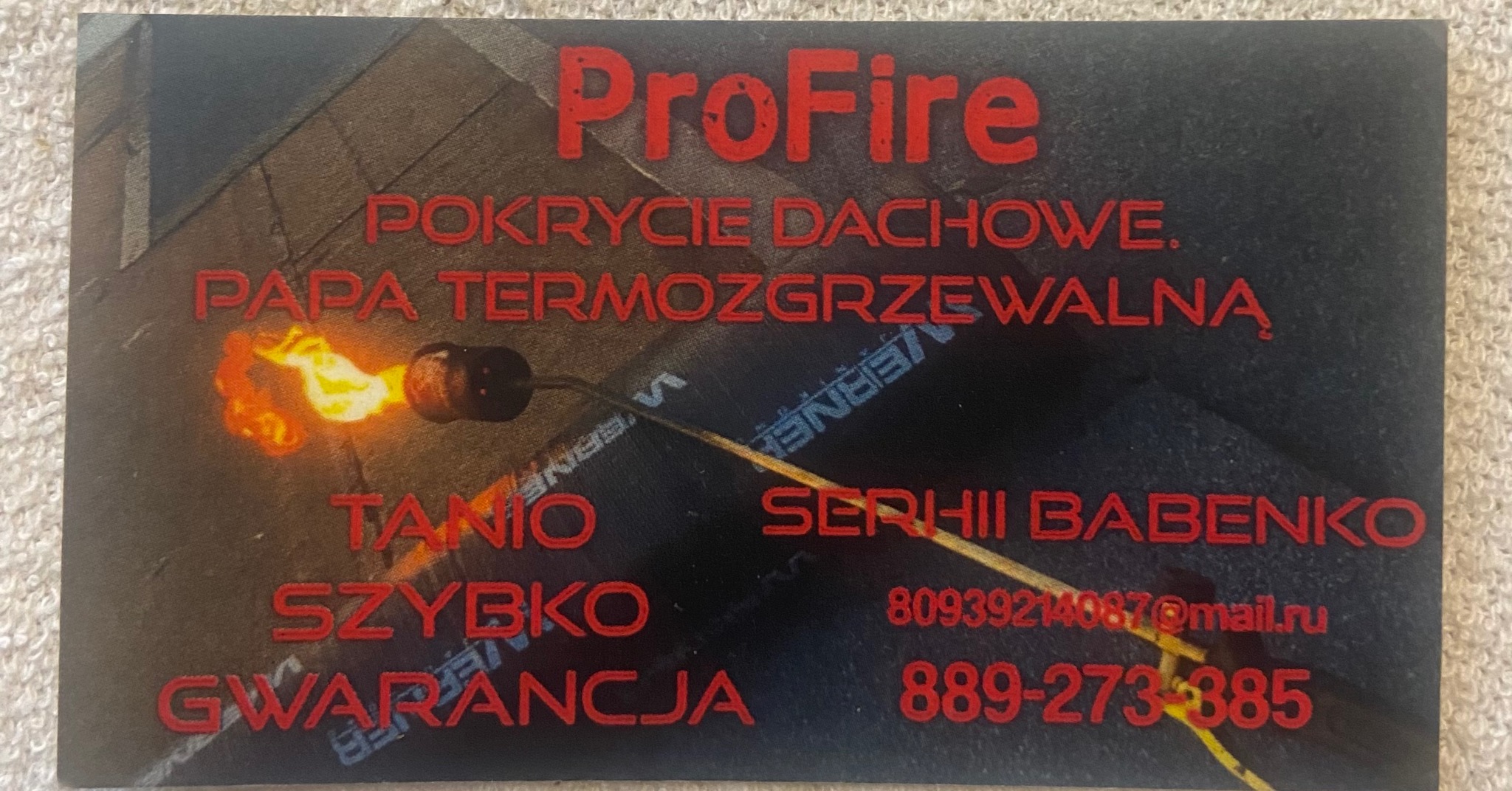 Wizytówka firmy ProFire z czerwonym napisem i płomieniem palnika, oferującej pokrycie dachowe papą termozgrzewalną, z danymi kontaktowymi Serhii Babenko.