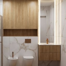 Studio Sawubona - Nowoczesna łazienka z drewnianymi szafkami, marmurowymi płytkami i podświetlanym lustrem. Bidet i toaleta wiszące. Parkiet ułożony w jodełkę.