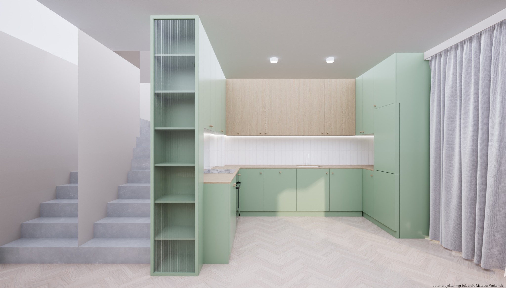 Jasna kuchnia w odcieniach zieleni z drewnianymi akcentami, minimalistyczne szafki, białe płytki nad blatem, regał z ryflowanego szkła, schody w tle, parkiet w jodełkę.