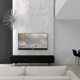 Trans - Hurt Sp. J. - Nowoczesny salon z białym narożnikiem, czarną szafką RTV pod telewizorem, dekoracyjną lampą w kształcie gwiazdy i barem z czarnymi hokerami na złotych nóżkach.