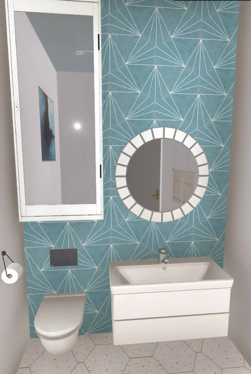 Nowoczesna łazienka z turkusowymi płytkami w geometryczny wzór, okrągłe lustro z białymi obramowaniami, biała szafka z umywalką i podwieszana toaleta.