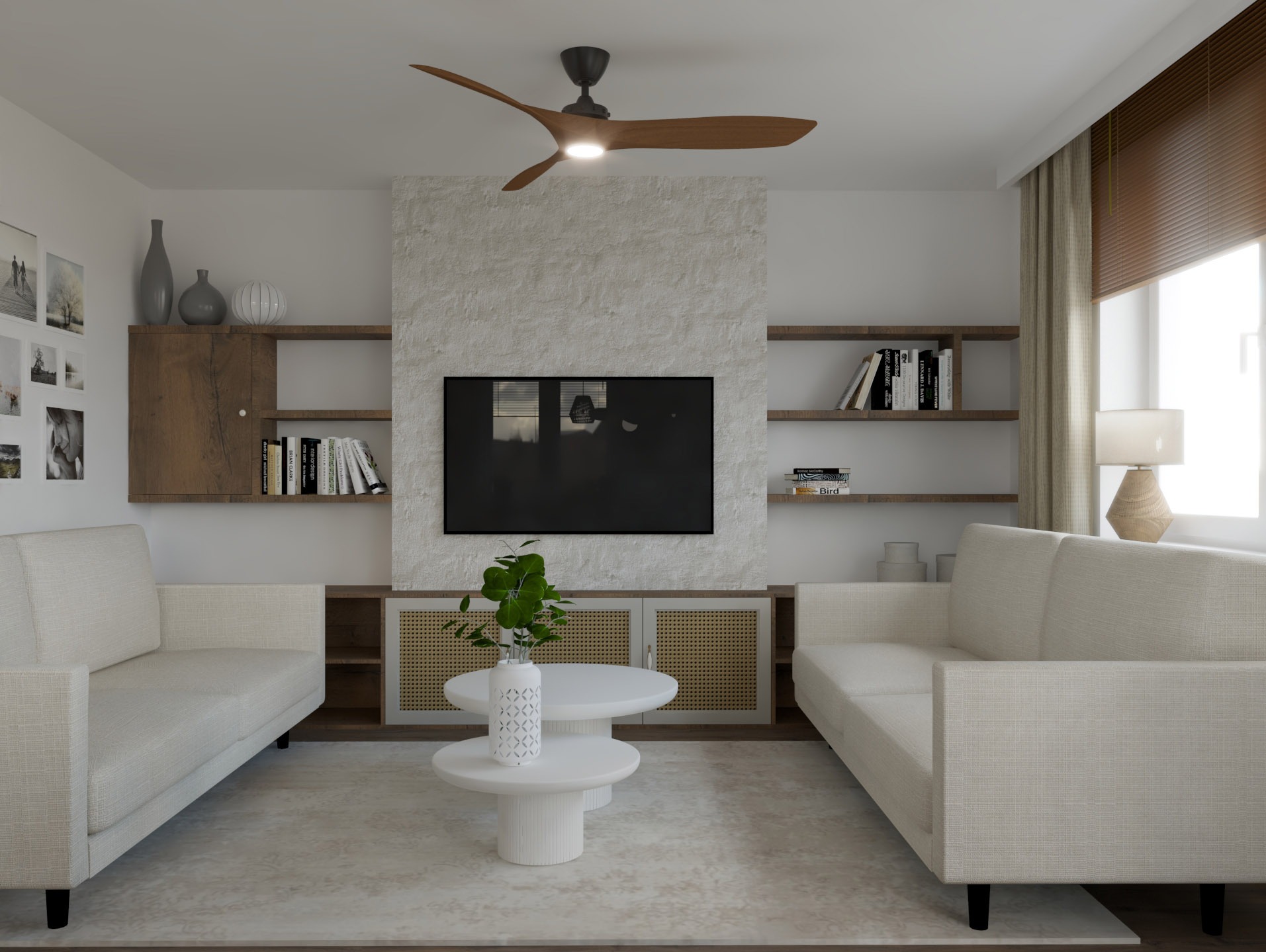 Salon z dwoma kremowymi sofami, stolikiem kawowym i telewizorem na tle ściany z kamienia dekoracyjnego. Drewniane półki z książkami i dekoracjami.