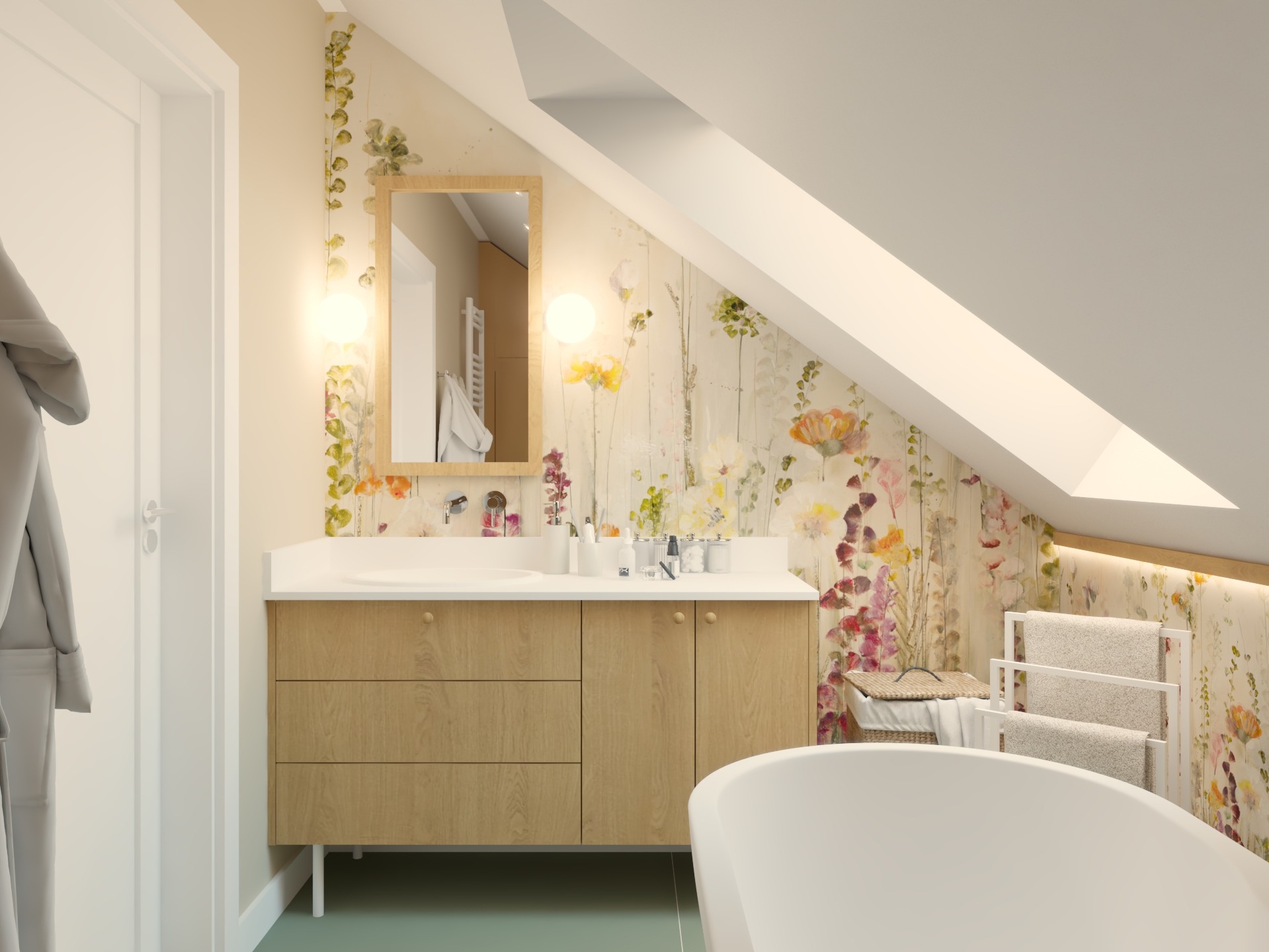 Jasna łazienka na poddaszu z drewnianą szafką pod umywalką, lustrem w drewnianej ramie i kwiatową tapetą. Widoczna wanna i grzejnik drabinkowy.