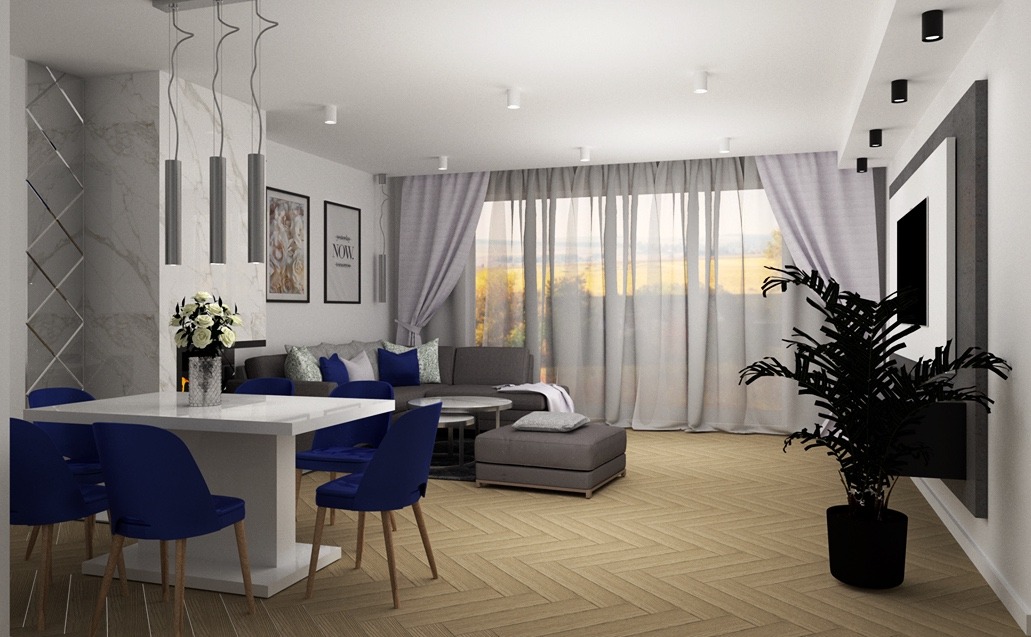 Nowoczesne wnętrze z białym stołem i niebieskimi krzesłami, parkiet w jodełkę, szara sofa z poduszkami i duża roślina doniczkowa pod telewizorem.