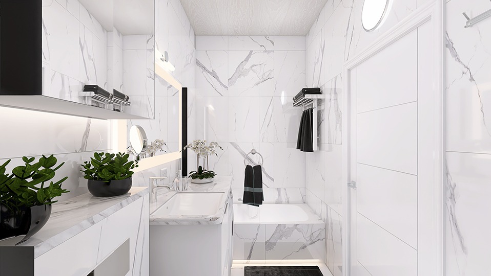 Nowoczesna łazienka w bieli i szarościach z marmurowym wzorem, roślinami w czarnych doniczkach na blacie i okrągłym lustrem nad umywalką.