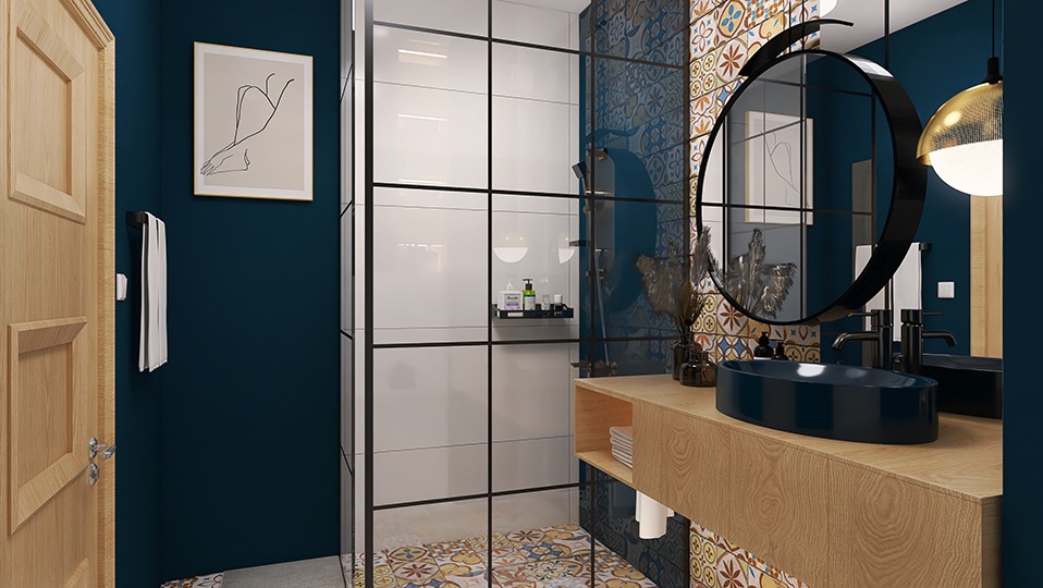 Niebieska łazienka z kabiną prysznicową typu walk-in, okrągłym lustrem z czarną ramą i drewnianą szafką z umywalką w kształcie łódki.