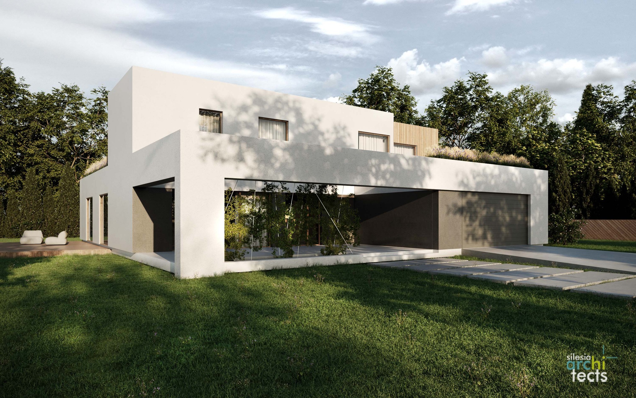 Dwukondygnacyjny dom w stylu modernistycznym z płaskim dachem, zielonym dachem i dużymi przeszkleniami, otoczony bujną zielenią, z widocznym fragmentem tarasu i betonowymi płytami ścieżki.