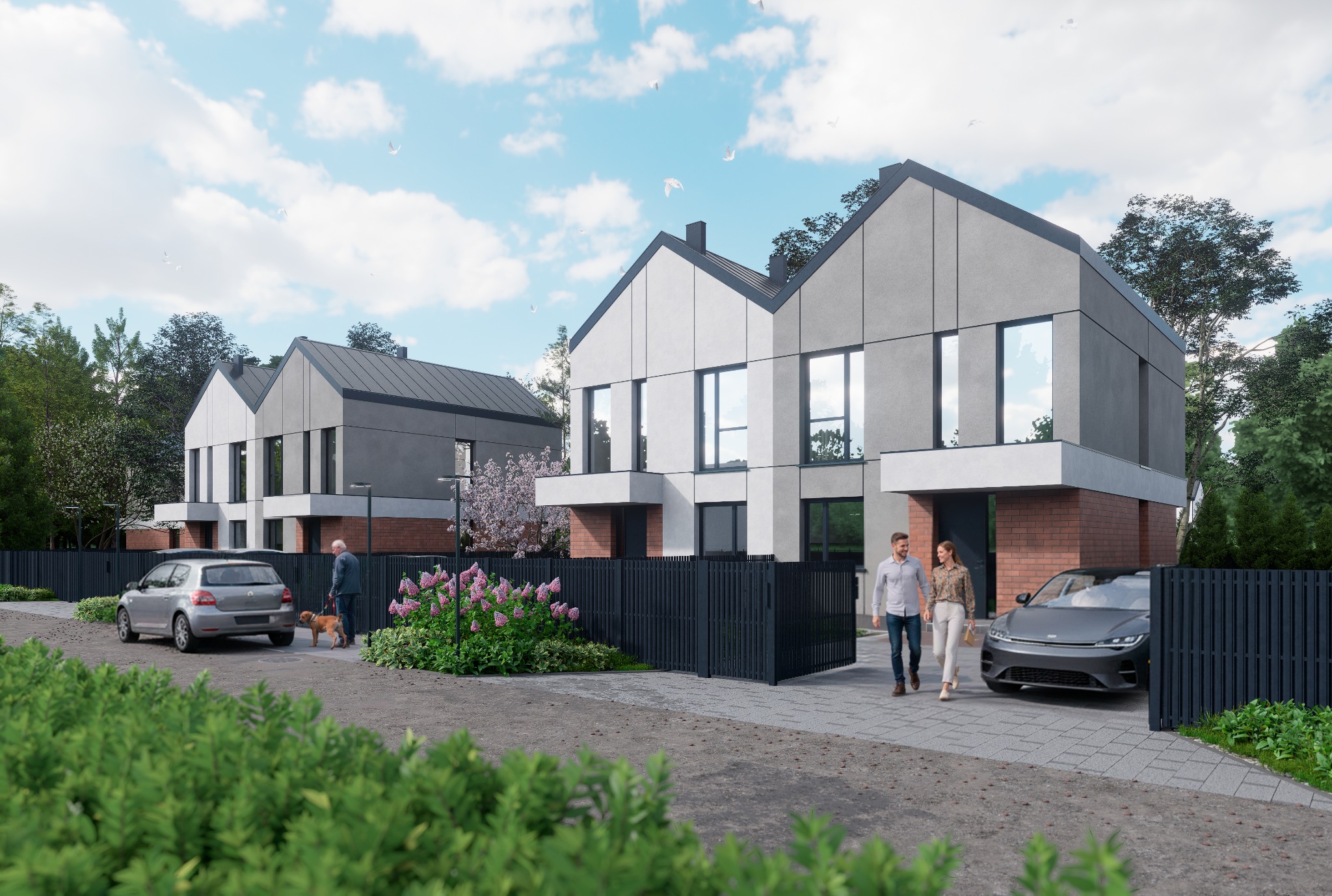 Nowoczesne domy szeregowe z szarymi elewacjami, czarnym ogrodzeniem i zadbanym otoczeniem. Para spaceruje po posesji, a obok stoi samochód.
