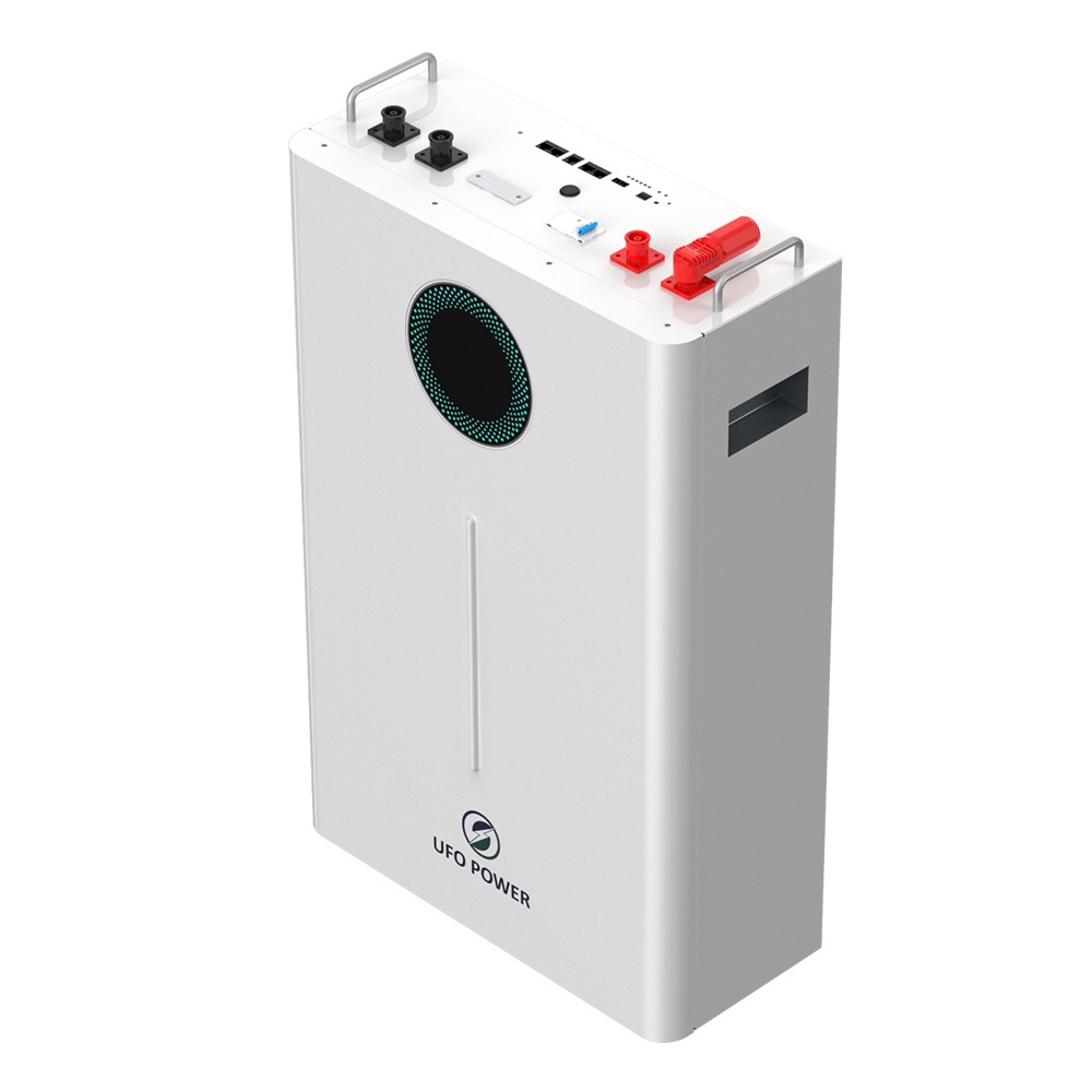 Biały akumulator energii z okrągłym otworem wentylacyjnym i logo UFO Power, widok z góry na złącza i uchwyty.