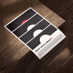 Joanna Stawowy - Minimalistyczny plakat z geometrycznym wzorem półkoli w kolorach czerni, bieli i czerwieni, leżący na szarej, betonowej powierzchni w promieniach słońca. Plakat zawiera napis 'Don't worry about it.