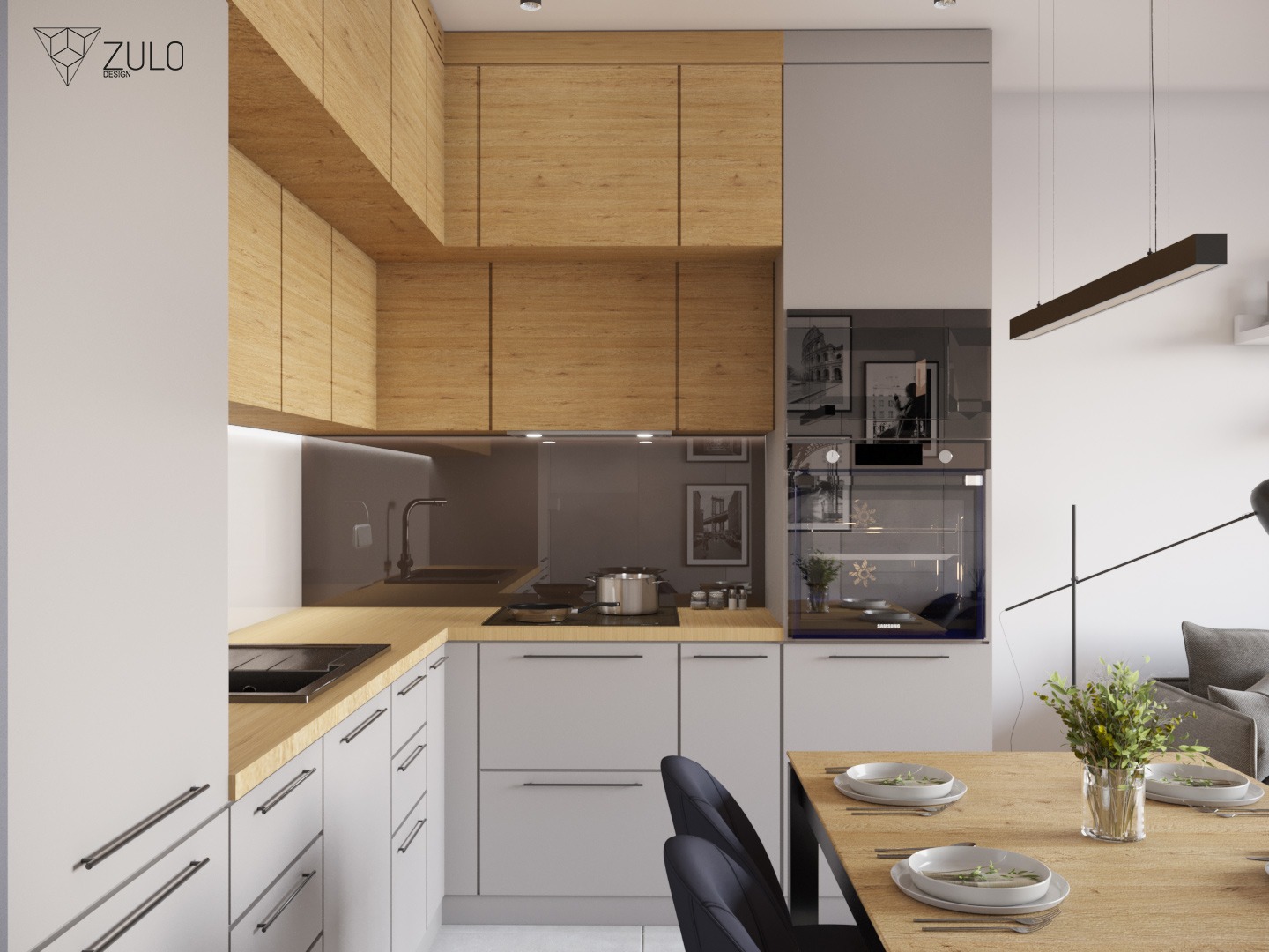 Nowoczesna kuchnia z drewnianymi szafkami górnymi, szarymi szafkami dolnymi, czarnym zlewem i drewnianym blatem, oświetlona wiszącą lampą. Na stole nakrycia dla czterech osób.