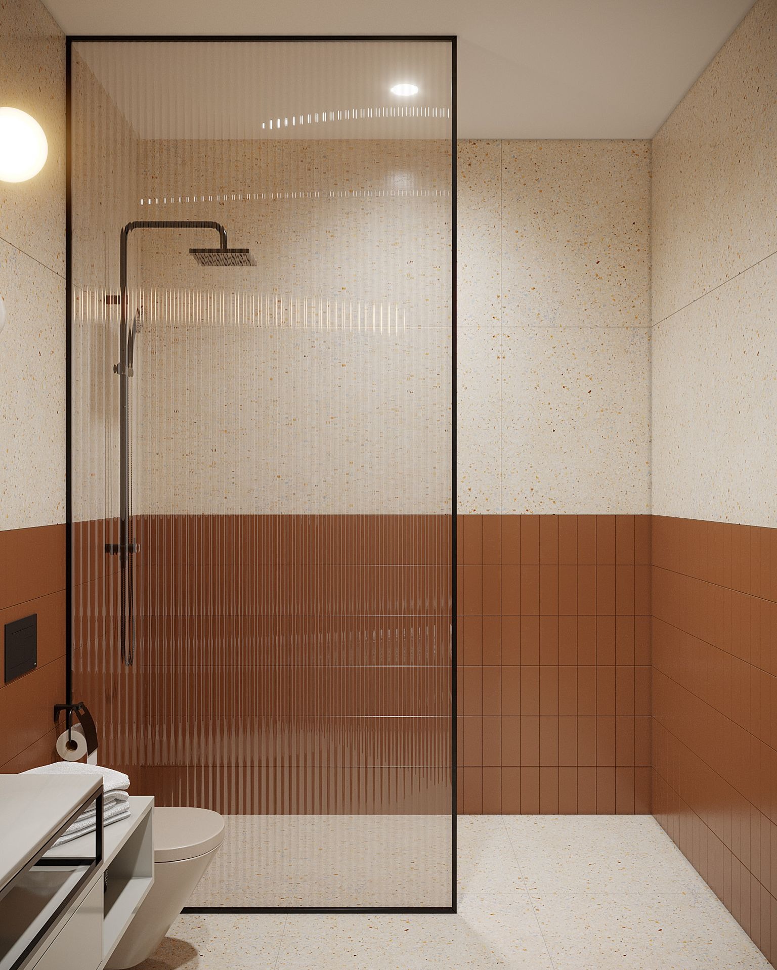 Wizualizacja łazienki z kabiną prysznicową oddzieloną szklaną ścianką z czarną ramą, jasnymi płytkami imitującymi lastryko w górnej części ścian i na podłodze oraz brązowymi płytkami w dolnej...