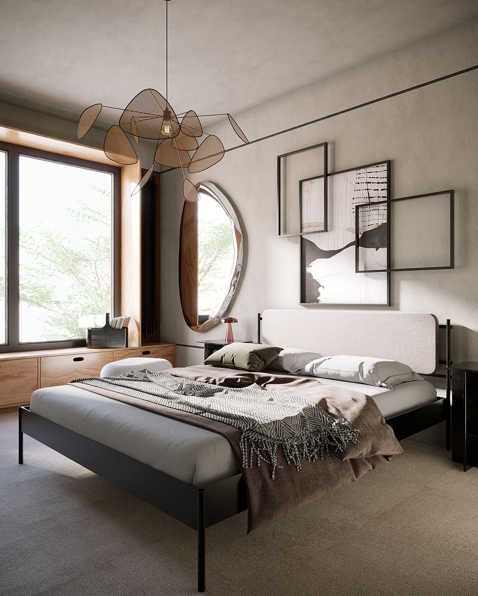 Jasna sypialnia z łóżkiem na czarnej ramie, drewnianą komodą pod oknem i abstrakcyjną lampą wiszącą, uzupełniona o owalne lustro i minimalistyczne obrazy na ścianie.