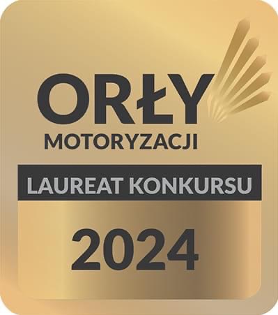 Złoty emblemat 'Orły Motoryzacji' z napisem 'Laureat Konkursu 2024' na kwadratowej plakietce.