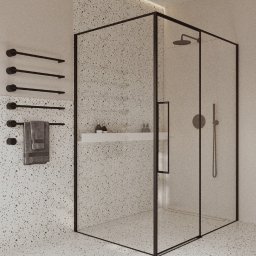 Prosvero Studio Aranżacji Wnętrz - Nowoczesna kabina prysznicowa z czarnymi ramami i armaturą, na tle ściany i podłogi w stylu lastryko. Minimalistyczny design z półką na kosmetyki.