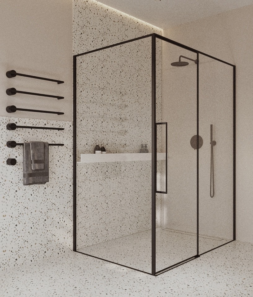 Nowoczesna kabina prysznicowa z czarnymi ramami i armaturą, na tle ściany i podłogi w stylu lastryko. Minimalistyczny design z półką na kosmetyki.