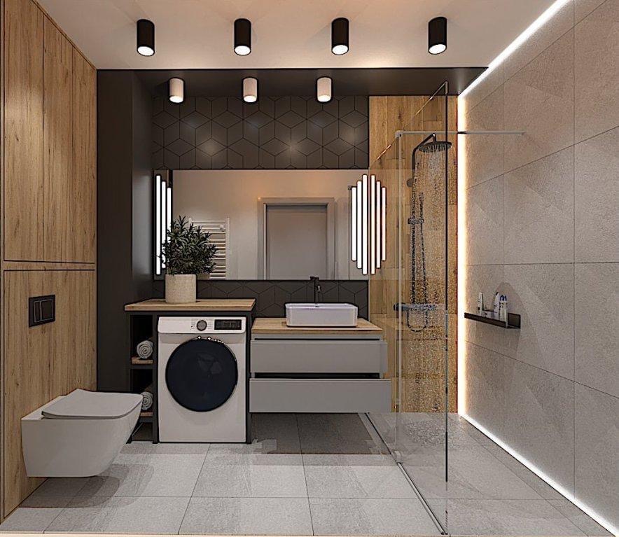 Nowoczesna łazienka z pralką pod blatem umywalki, szklaną kabiną prysznicową i geometryczną tapetą za lustrem.