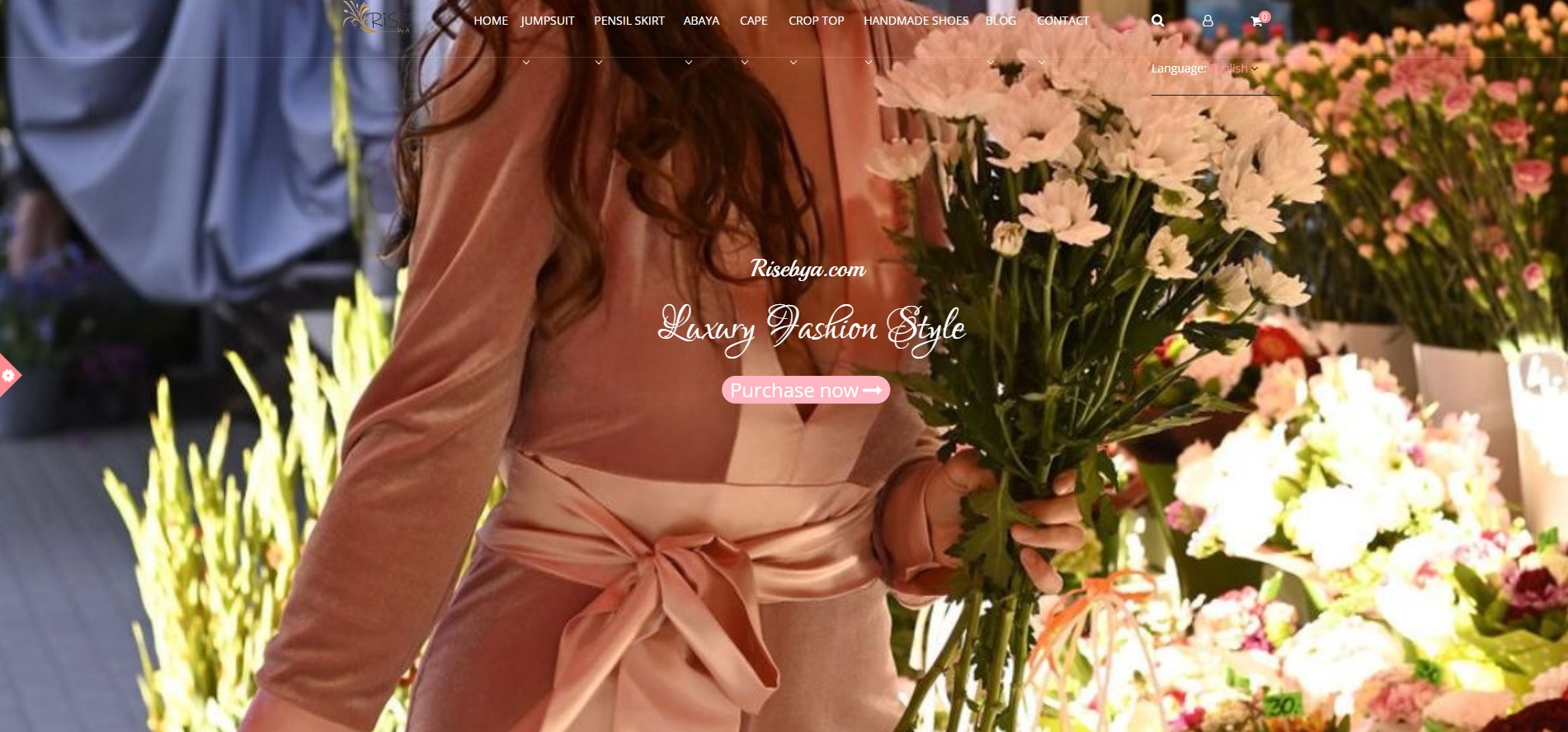 Strona internetowa sklepu odzieżowego Risebya.com, prezentująca modelkę w welurowym kombinezonie z bukietem białych kwiatów, z widocznym menu nawigacyjnym i przyciskiem 'Purchase now'.