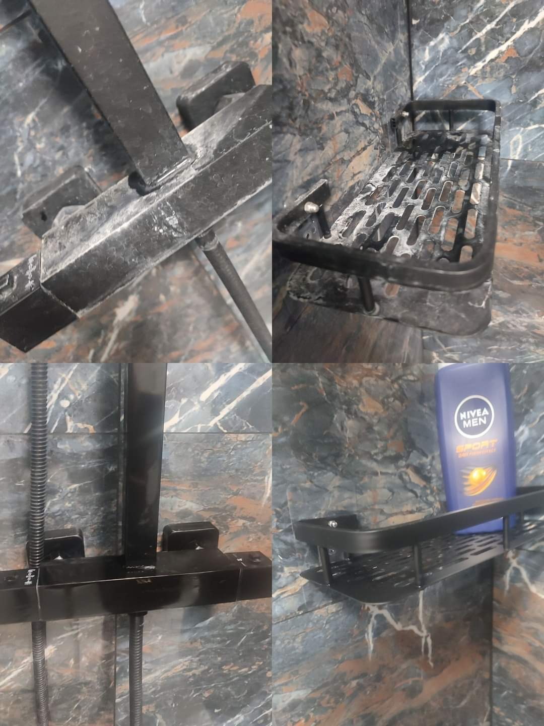 Zakamieniona, czarna armatura prysznicowa i półka łazienkowa z butelką płynu do mycia, na tle marmurowej ściany z widocznymi śladami osadu.