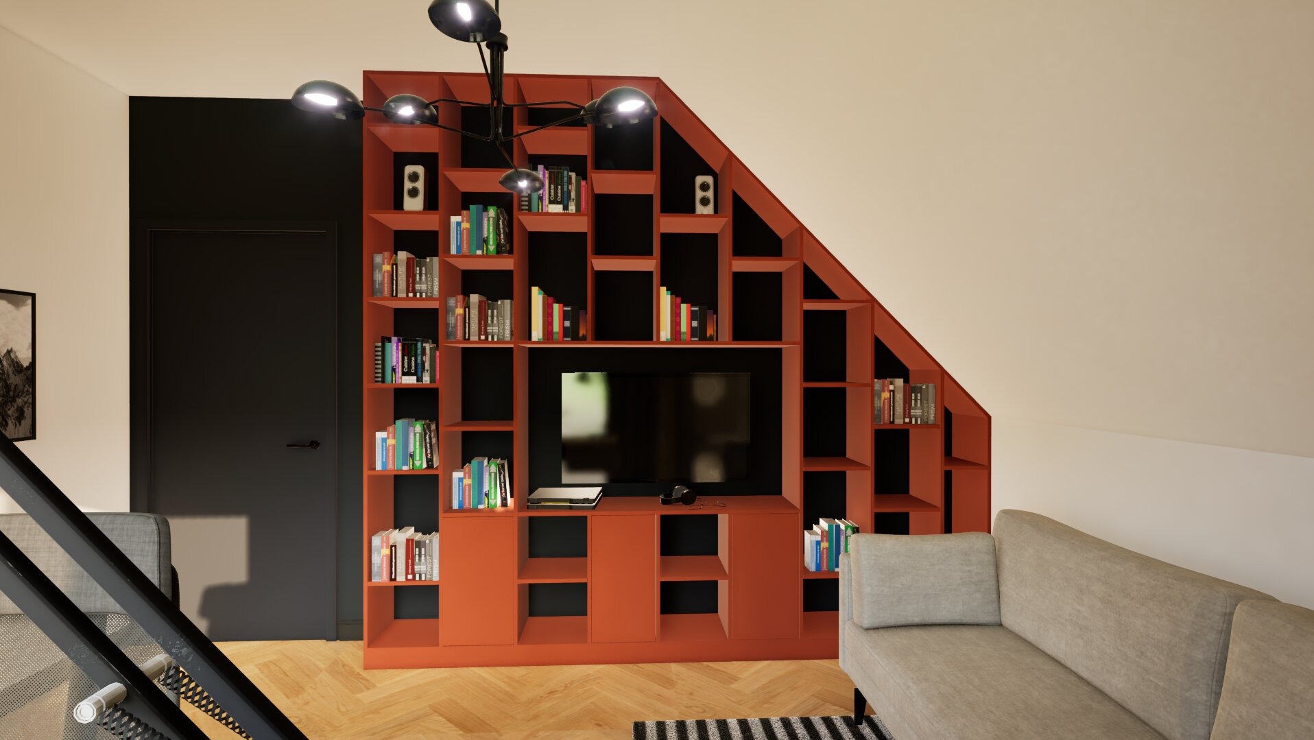 Salon z pomarańczową zabudową regałową pod skosem, w której umieszczono telewizor i książki; obok szara sofa i czarne drzwi.