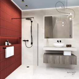 Zuzanna Maszner - Nowoczesna łazienka z czerwoną ścianą z wypukłych płytek, czarną armaturą prysznicową i umywalką na blacie z szafką, oświetlona dekoracyjną lampą.