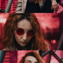 Kobieta z rudymi kręconymi włosami w okularach z czerwonymi szkłami pozuje na tle czerwonego budynku i metalowej konstrukcji. Ujęcia z różnych perspektyw.