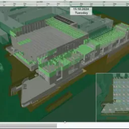 Wizualizacja 3D harmonogramu budowy z zaznaczonymi etapami prac: betonowanie, stalowe konstrukcje i fasada. Widok z góry, plan budynku z datą 15.10.2024.