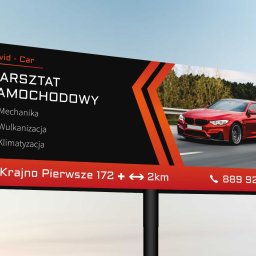 Varietatis - Billboard reklamowy warsztatu samochodowego David-Car z czerwonym sportowym samochodem, oferującego mechanikę, wulkanizację i klimatyzację, zlokalizowanego w Krajnie Pierwszym.