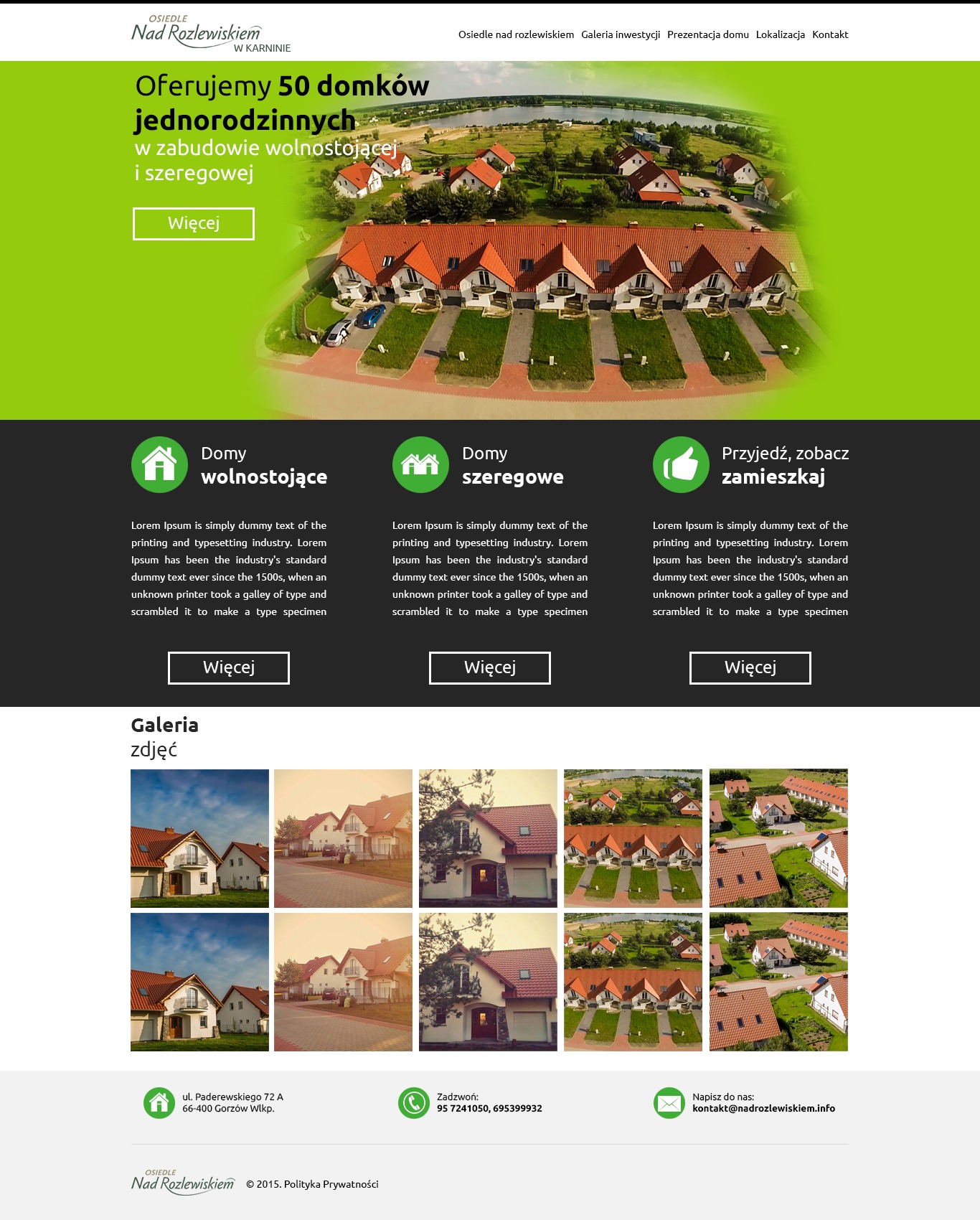 Aerial view of a residential complex with row houses featuring red tile roofs, interspersed with green lawns and a distant lake under a bright sky.