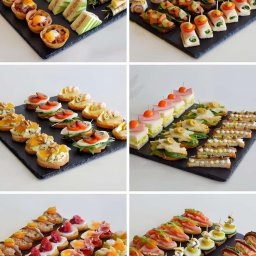 SALAMO ALIKOM SALEM ELMAADALAWI - Różnorodne, elegancko podane przekąski na czarnych łupkowych deskach: tartaletki z jajkiem, kanapki z awokado, roladki z szynką i melonem, bruschetty z pomidorami i bazylią, koreczki z łososiem...