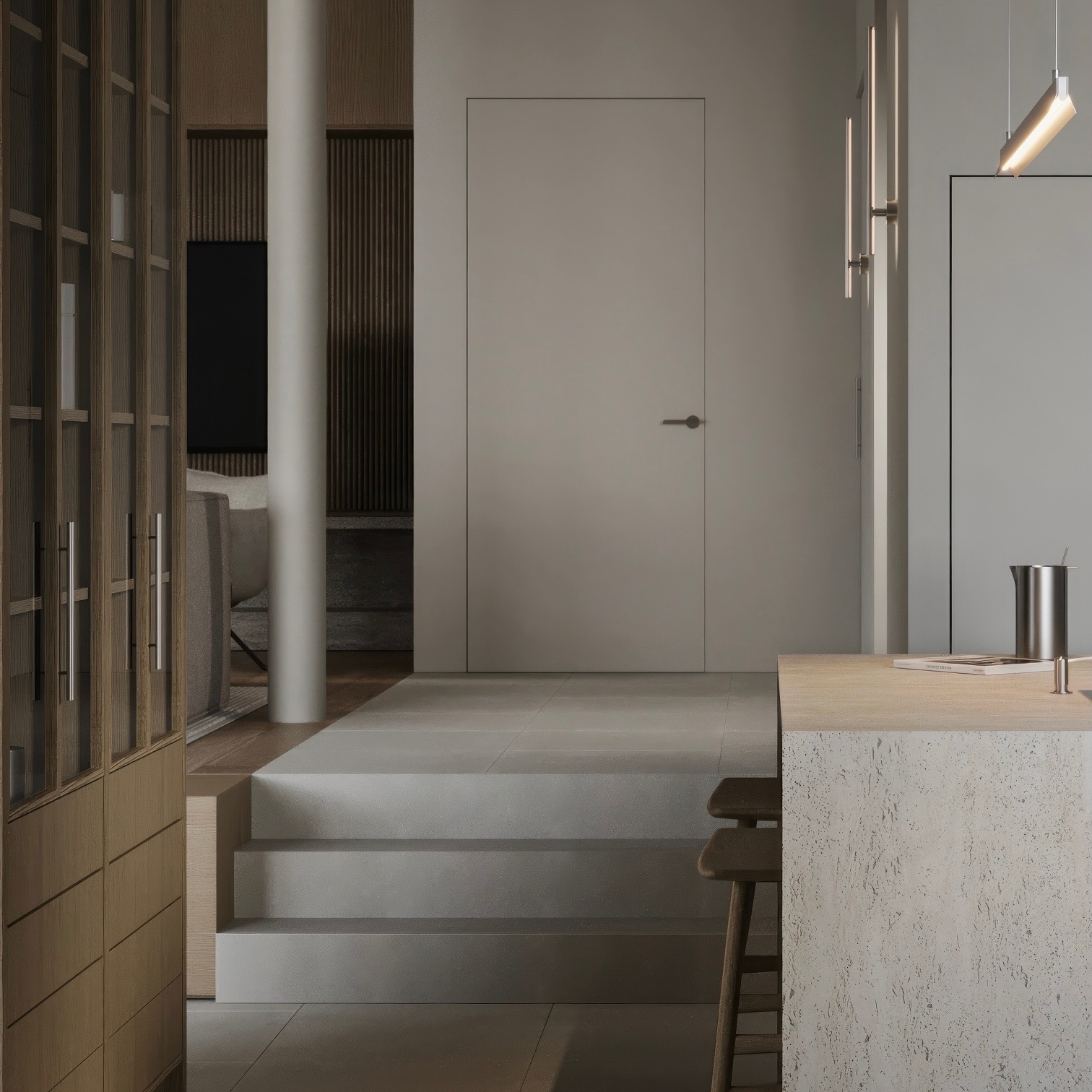 Minimalistyczne wnętrze: schody z płytek prowadzą do drzwi, kolumna, drewniana zabudowa, wyspa kuchenna z hokerami, oświetlenie liniowe.