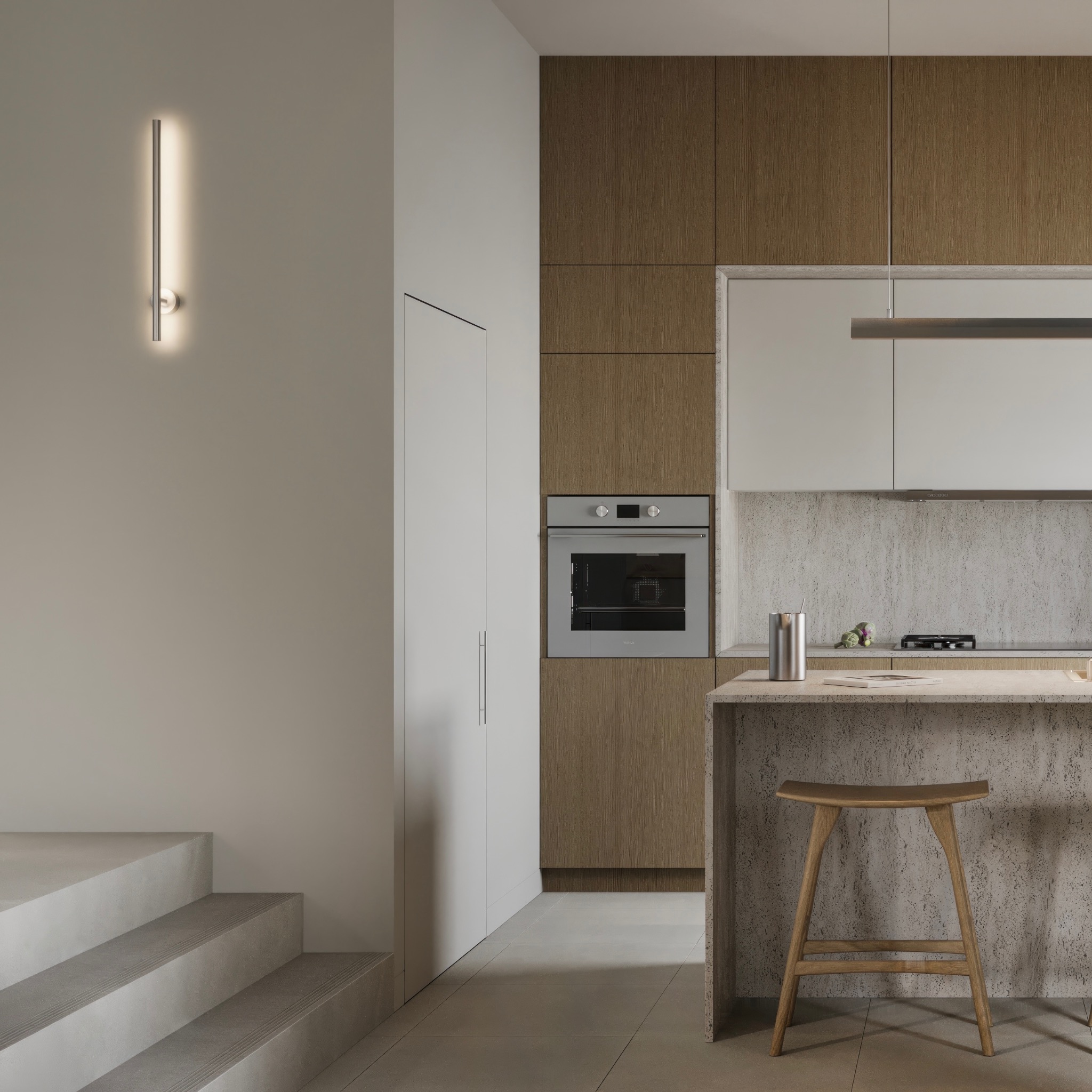 Minimalistyczna kuchnia z drewnianymi i białymi szafkami, wyspą z betonu architektonicznego, drewnianym stołkiem barowym i oświetleniem LED na ścianie.