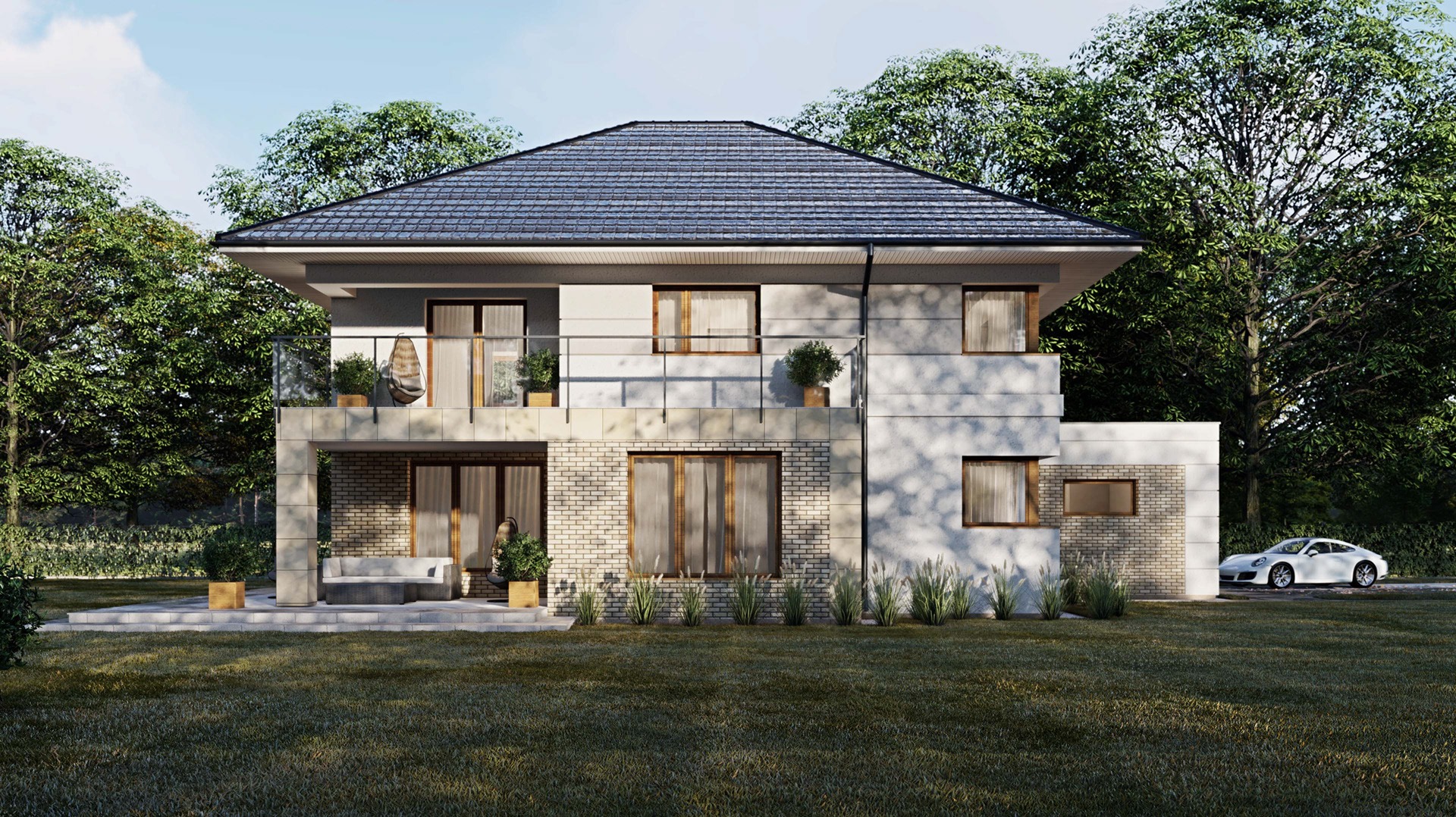 Dwupiętrowy dom z płaskim dachem i balkonem, z elementami z jasnej cegły, otoczony zielenią, z białym samochodem sportowym zaparkowanym obok.