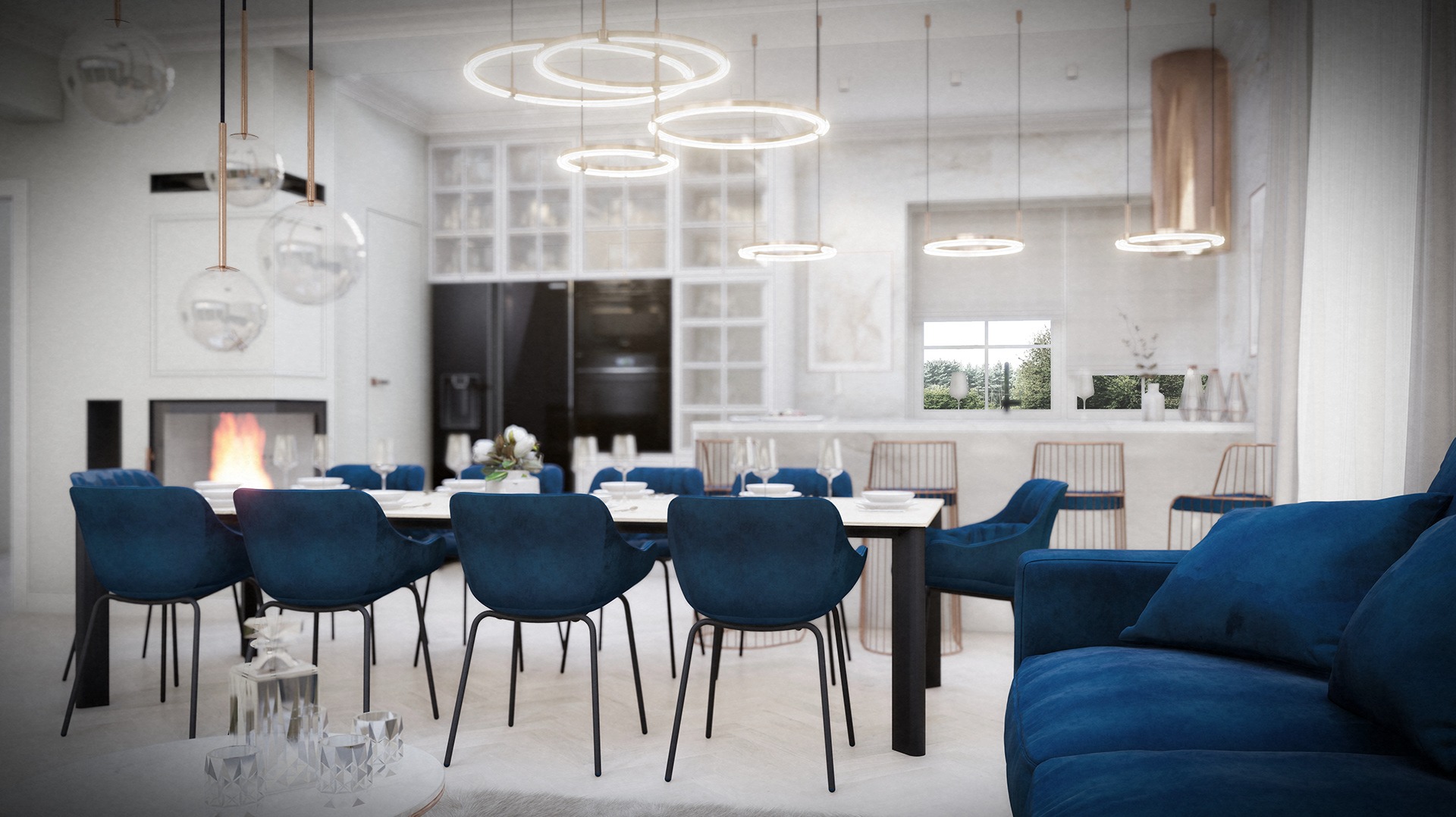 Wnętrze jadalni z niebieskimi krzesłami velvet, marmurowym stołem, oświetleniem pierścieniowym i kominkiem w tle, widok z salonu.