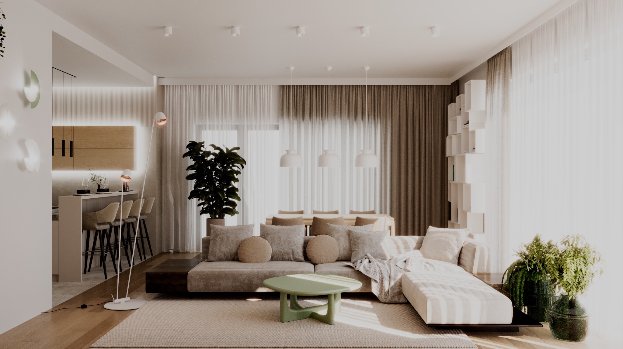 Jasne, przestronne wnętrze mieszkania z beżową sofą, zielonym stolikiem kawowym i otwartą kuchnią z barkiem, oświetlone naturalnym światłem wpadającym przez okna z białymi i brązowymi zasłonami.