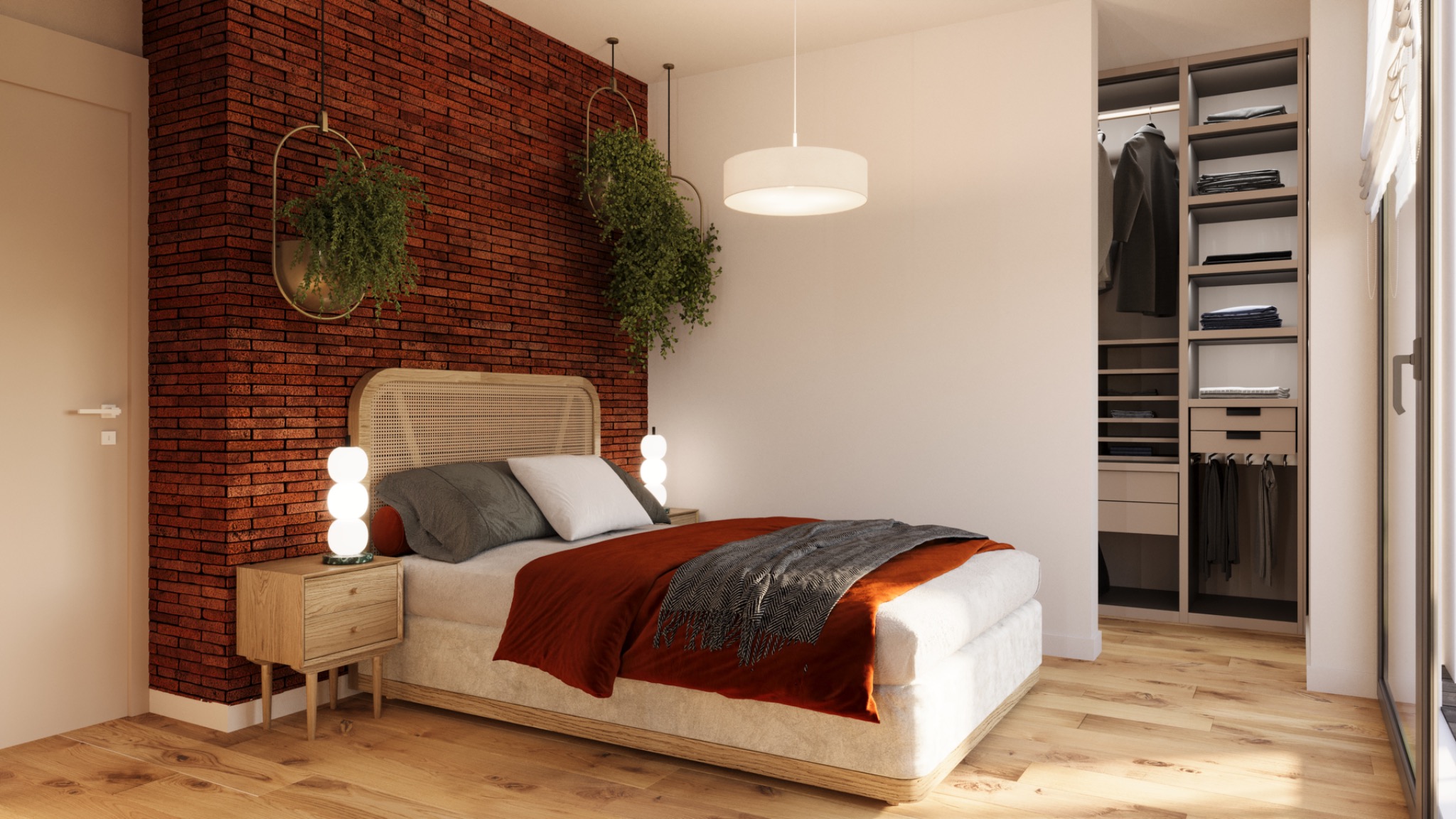 Sypialnia z ceglaną ścianą, łóżkiem z rattanowym zagłówkiem, wiszącymi roślinami w metalowych obręczach, szafką nocną z lampą kulkową i garderobą wnękową.