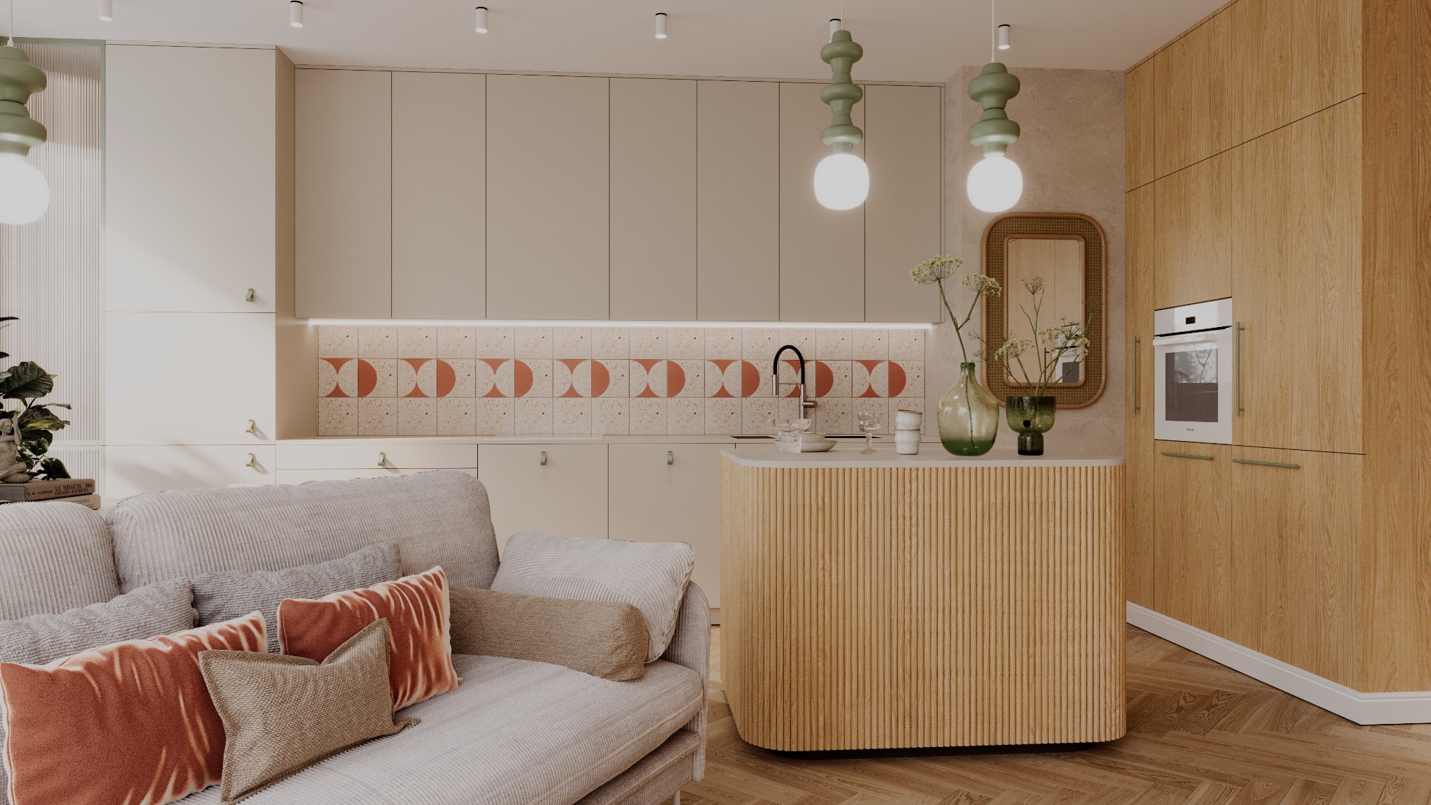 Beżowa kuchnia z wyspą, terakotowymi płytkami i drewnianymi szafkami, widok z salonu z szarą sofą i poduszkami w odcieniach brązu i pomarańczy.