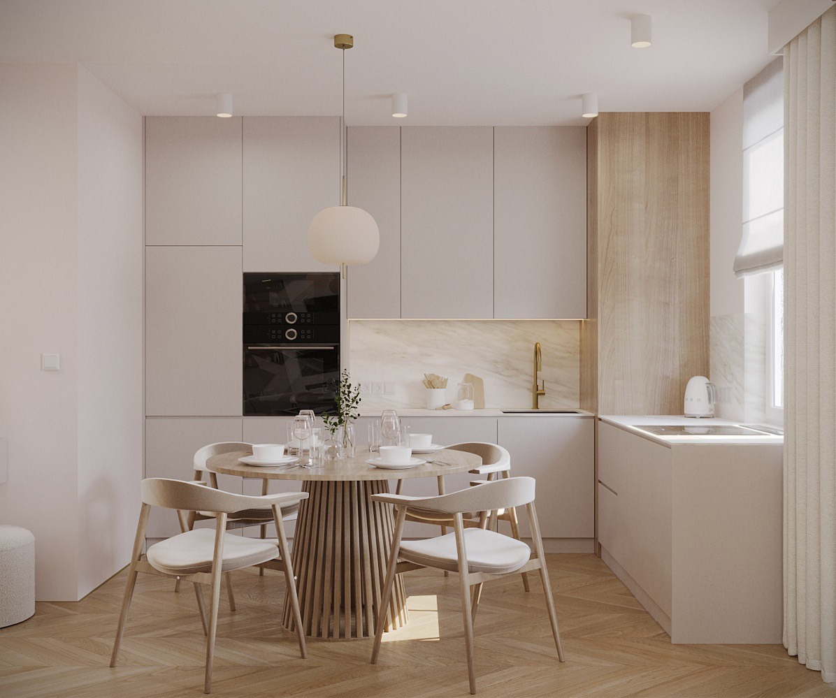 Jasna kuchnia z okrągłym stołem z drewnianą podstawą i krzesłami w stylu skandynawskim, oświetlona wiszącą lampą z kulistym kloszem. Na blacie marmurowy wzór.