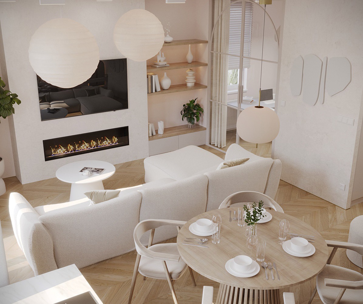 Jasne, przestronne wnętrze salonu z jadalnią, utrzymane w neutralnej palecie barw, z okrągłym stołem jadalnym nakrytym dla czterech osób, miękką sofą modułową i nowoczesnym kominkiem pod telewizorem.