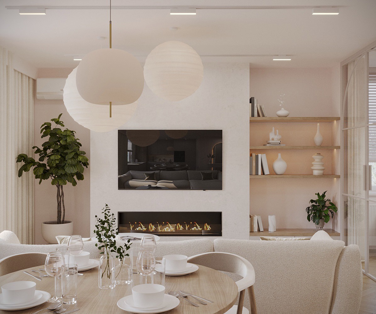 Jasne, przestronne wnętrze salonu z jadalnią, okrągły stół nakryty do posiłku, trzy papierowe lampy wiszące, telewizor nad kominkiem, półki z dekoracjami i roślinami, minimalistyczny design.