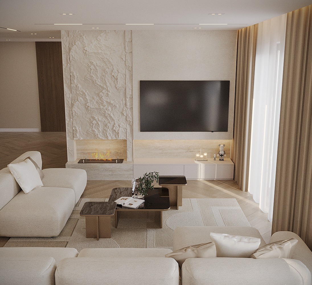 Jasny salon z kominkiem obłożonym kamieniem, telewizorem na ścianie, beżową sofą modułową i stolikami kawowymi z ciemnymi blatami.