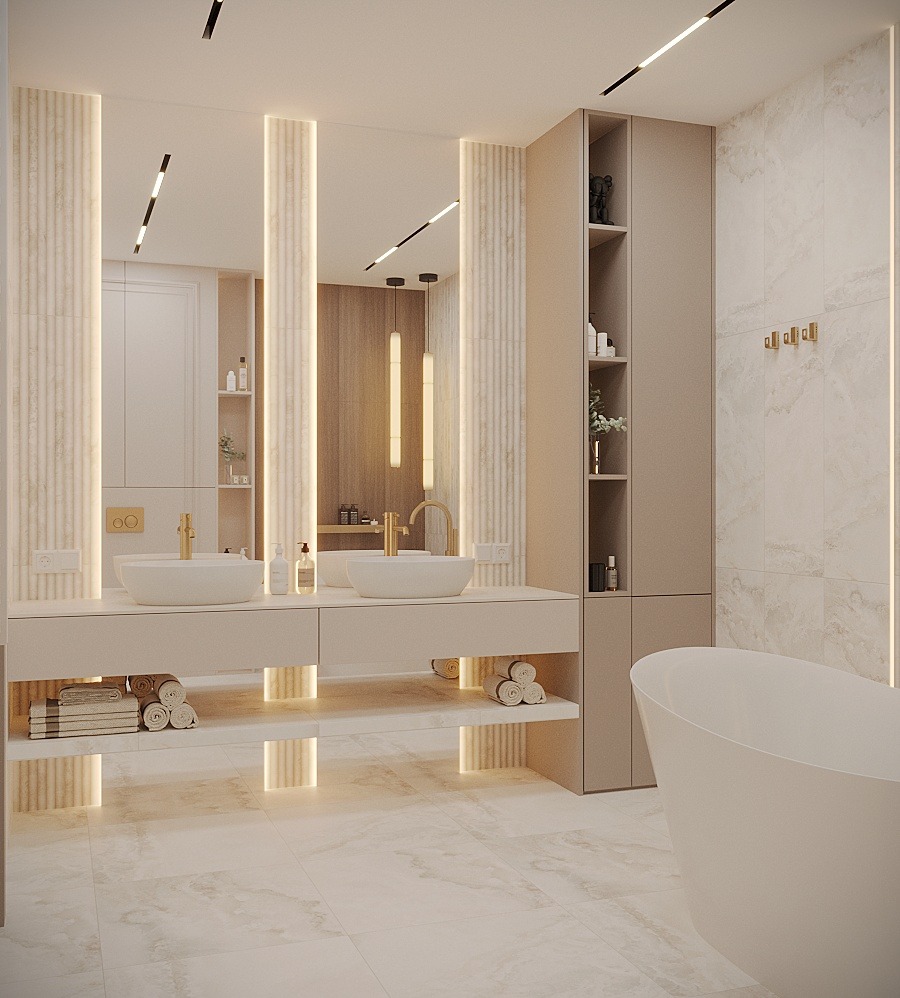 Jasna łazienka z dwoma umywalkami nablatowymi, złotą armaturą, podświetlanymi półkami i szafką z otwartymi półkami, widoczna wanna wolnostojąca.