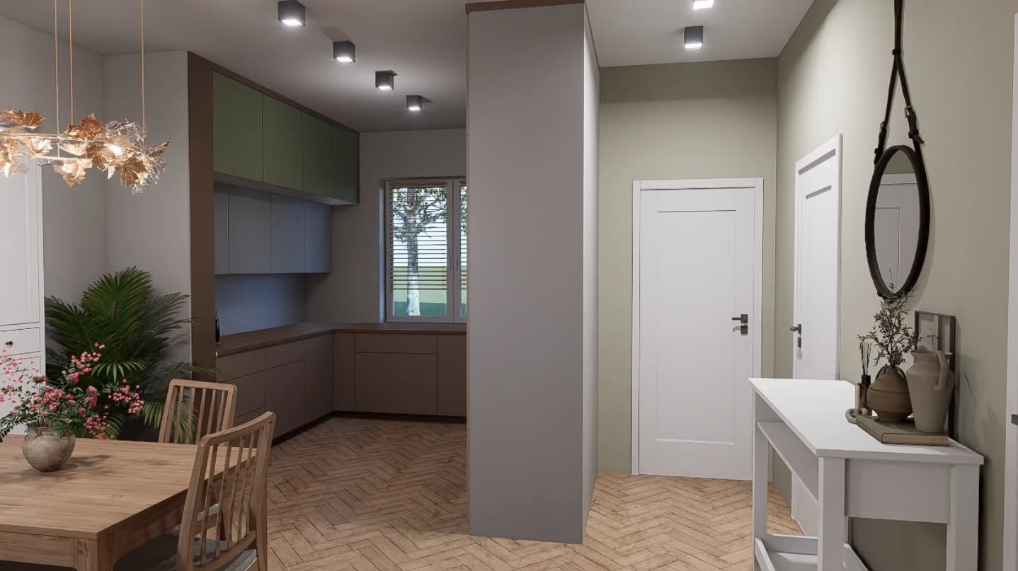 Wnętrze mieszkania: widok na kuchnię z jadalnią, z elementami dekoracyjnymi jak kwiaty i lustro w przedpokoju. Parkiet ułożony w jodełkę, neutralna kolorystyka.