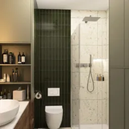 Nowoczesna łazienka z kabiną prysznicową, umywalką nablatową i WC. Ciemnozielone płytki kontrastują z terazzo. Oświetlenie punktowe i minimalistyczne dodatki.