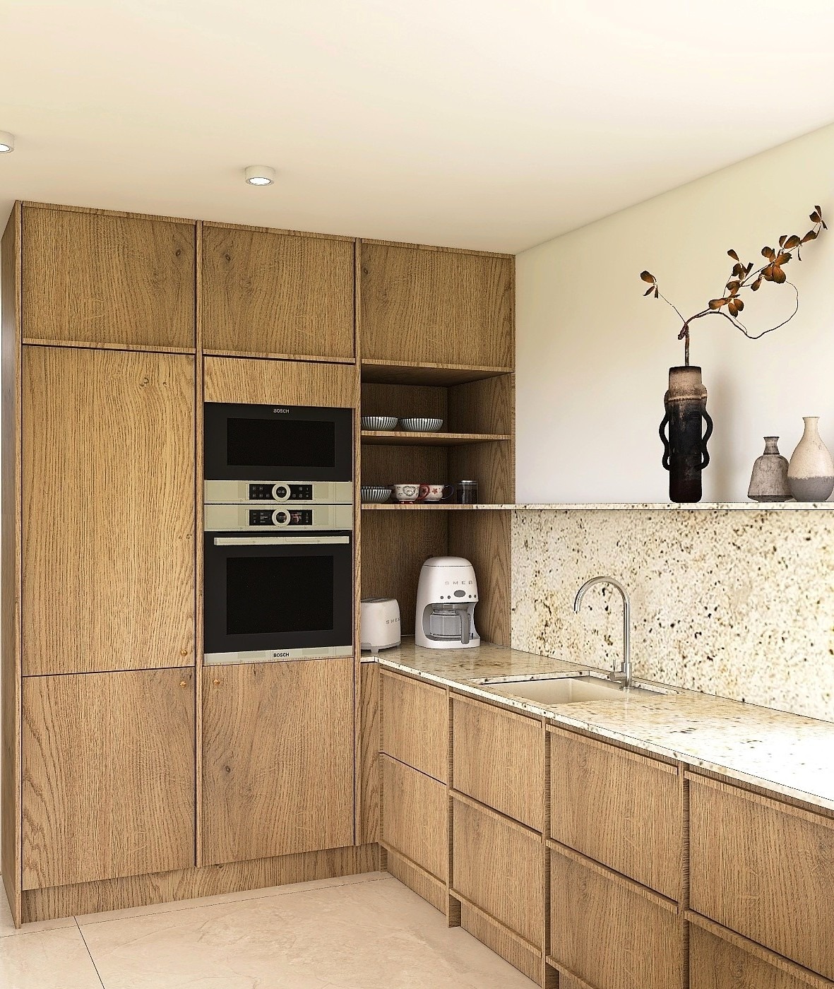 Jasna kuchnia z drewnianymi szafkami, wbudowanym piekarnikiem i mikrofalówką Bosch. Na blacie granitowym ekspres do kawy i toster Smeg.