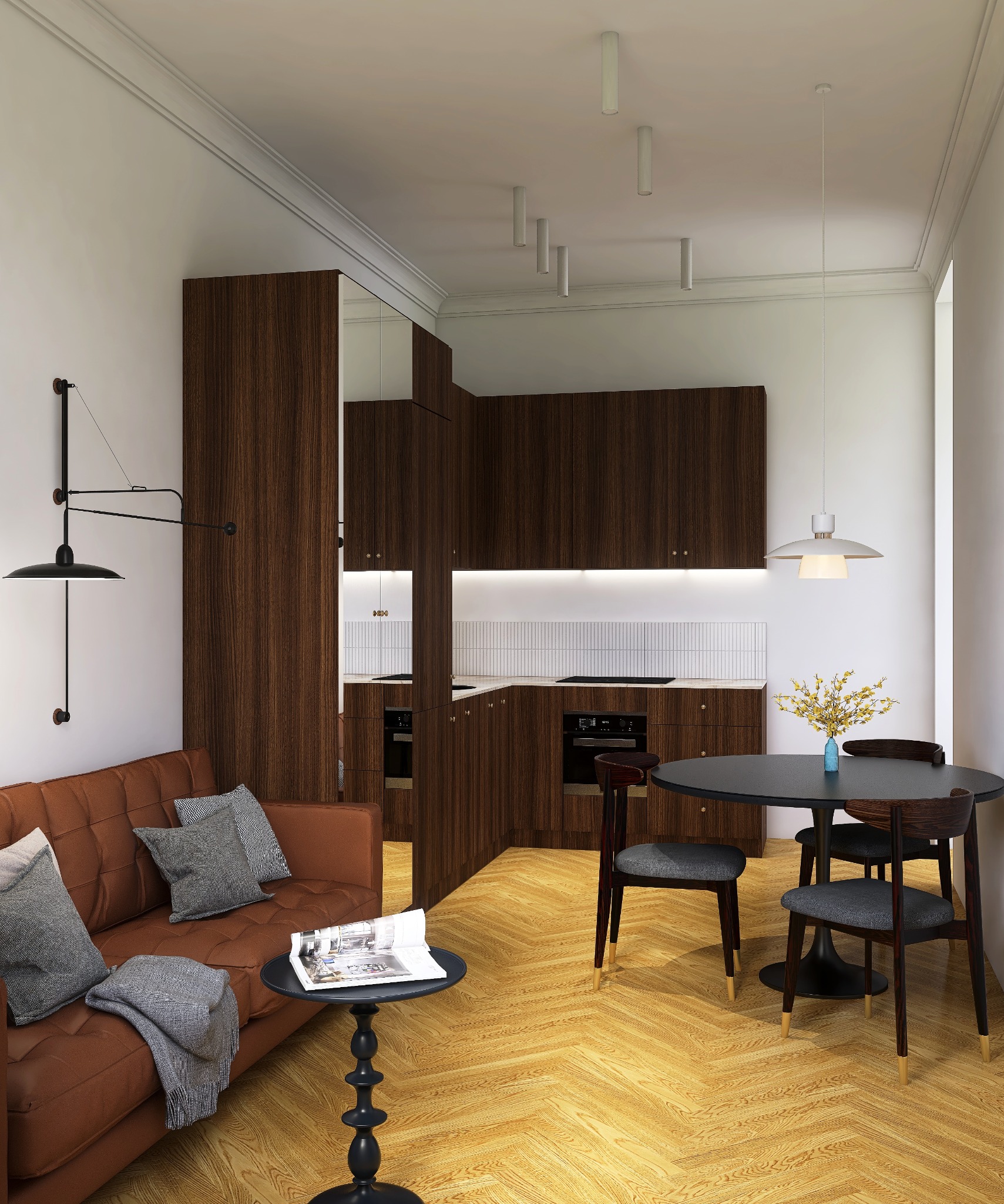 Salon z aneksem kuchennym w brązach: sofa, stolik z magazynem, okrągły stół z krzesłami. Parkiet w jodełkę, lampy sufitowe i ścienne, minimalistyczny design.