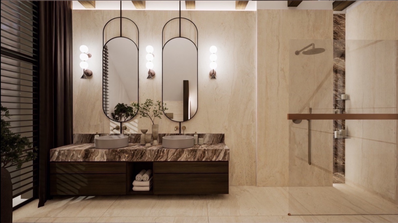 Elegancka łazienka z dwoma umywalkami na marmurowym blacie, owalnymi lustrami w czarnych ramach i beżowymi płytkami imitującymi marmur. Widoczny prysznic typu walk-in.