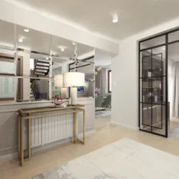 Elegancki przedpokój z lustrzaną ścianą, konsolą ze złotymi nogami, lampą stołową i czarną, przeszkloną ścianką działową. W tle widoczna jadalnia i schody.